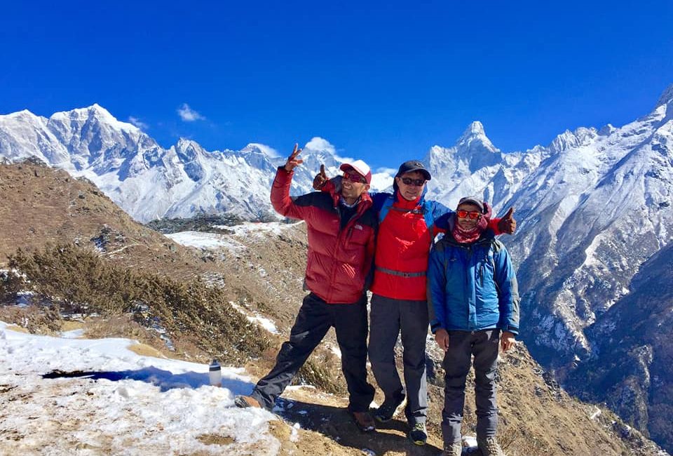 Trekking in Nepal- Colorful Rhododendron forest with Shining Mountains